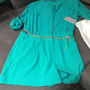 Long sleeved romper with belt .